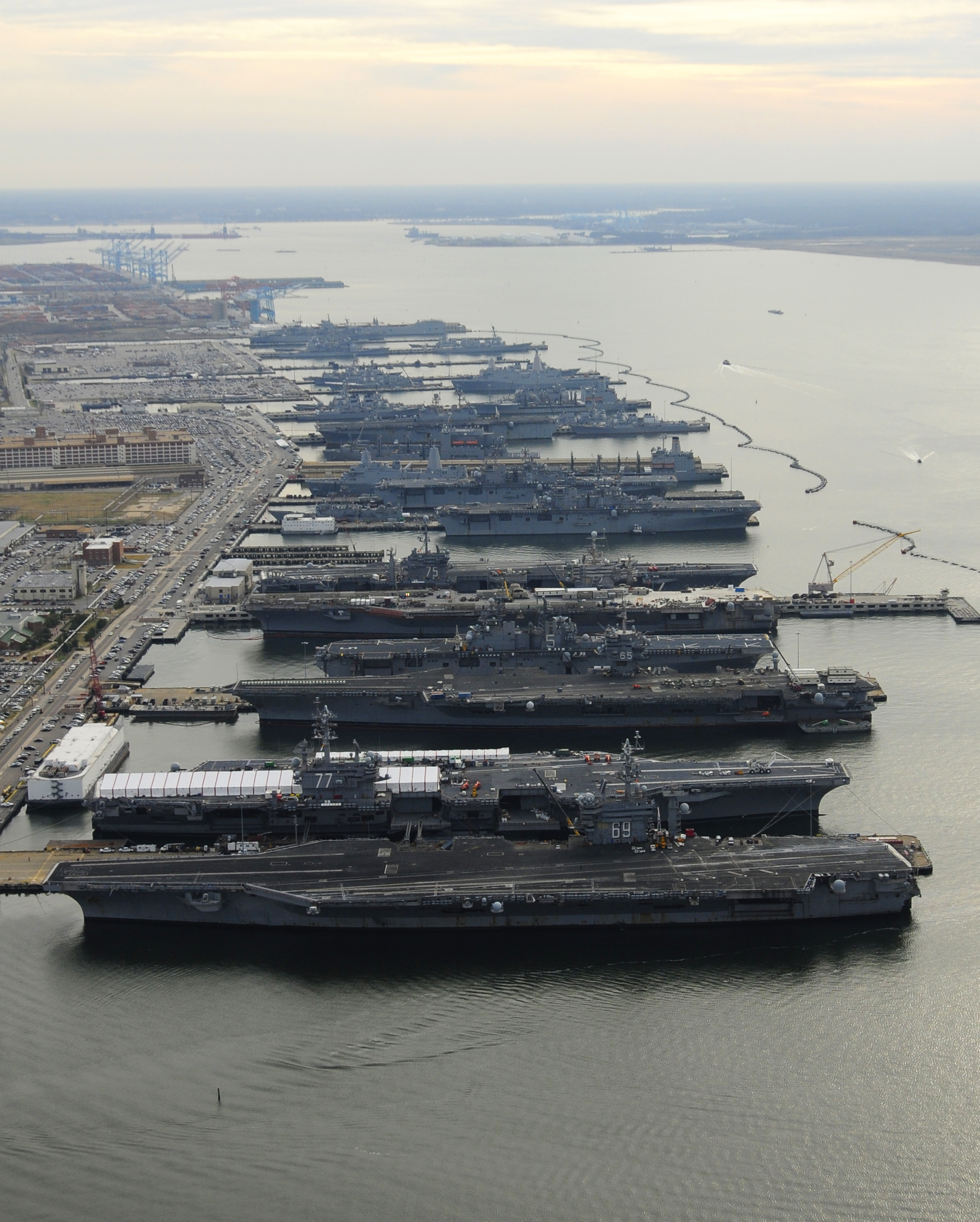 Six amphibious ships and five carriers moored in Norfolk.